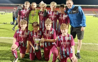 Development Centre Competitive Match Experience Game On Development Centre players celebrating success after a competitive football fixture