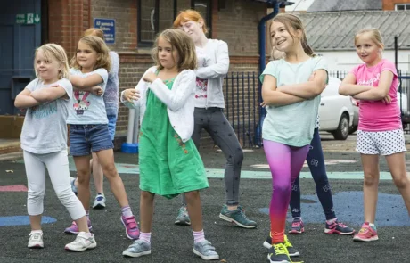 Children taking part in a fun street dance session during a Game On holiday course
