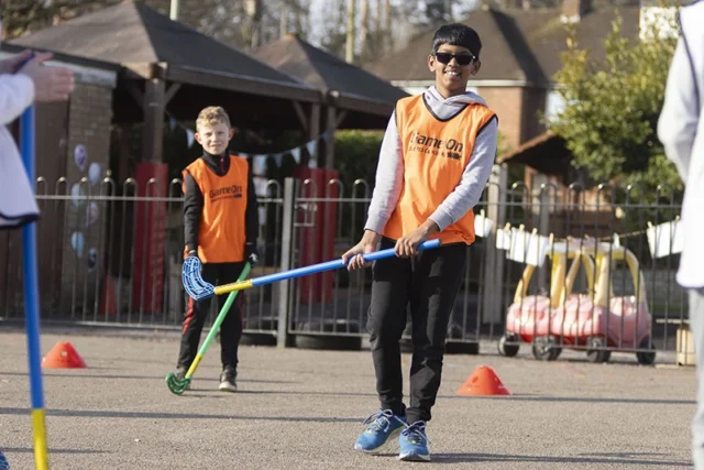 Primary school pupils taking part in outdoor sports skills coaching with Game On Sports Coaching during the school day